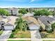 Charming single-story home with a well-kept lawn, mature landscaping, and a paved driveway at 8118 Fan Palm Way, Kissimmee, FL 34747
