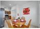 Kitchen and dining area shows a stainless steel refrigerator and matching appliances at 8118 Fan Palm Way, Kissimmee, FL 34747