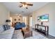 Spacious living area with hardwood floors and ample seating at 8118 Fan Palm Way, Kissimmee, FL 34747