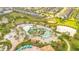 Resort-style community pool area featuring a lazy river, water slides, and cabanas at 9044 Azalea Sands Ln # 4011, Davenport, FL 33896