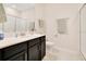 Well-lit bathroom with a single sink vanity, shower with glass doors, and modern fixtures for convenience at 9044 Azalea Sands Ln # 4011, Davenport, FL 33896