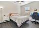 Cozy bedroom featuring a plush bed, neutral decor, and a bright window, creating a relaxing atmosphere at 9044 Azalea Sands Ln # 4011, Davenport, FL 33896