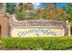 Stone sign for ChampionsGate community with manicured landscaping at 9044 Azalea Sands Ln # 4011, Davenport, FL 33896