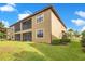 Attractive home exterior featuring a well-maintained lawn and charming architecture perfect for outdoor living at 9044 Azalea Sands Ln # 4011, Davenport, FL 33896