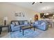 Inviting living room featuring comfortable seating, stylish decor, and an open layout to the dining area at 9044 Azalea Sands Ln # 4011, Davenport, FL 33896