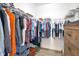 Spacious walk-in closet with ample storage, shelving, and rods for organized clothing and accessories at 9044 Azalea Sands Ln # 4011, Davenport, FL 33896