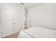 A bright bedroom features double doors and neutral carpeting at 9188 Chandler Dr, Groveland, FL 34736
