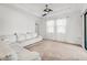 Bright living room featuring a ceiling fan, plush seating and neutral tones for a cozy yet stylish space at 9188 Chandler Dr, Groveland, FL 34736