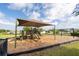 Community playground featuring climbing structures, a slide, and an expansive play area at 9188 Chandler Dr, Groveland, FL 34736