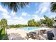 Community pool featuring a large pool, deck chairs, and palm trees, perfect for relaxing at 9188 Chandler Dr, Groveland, FL 34736