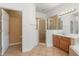 Bathroom featuring tile flooring, glass shower enclosure, double vanity, and ample lighting at 9469 Edenshire Cir, Orlando, FL 32836