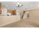 Inviting living space showcasing an open layout, tile floors, and staircase to the upper level at 9469 Edenshire Cir, Orlando, FL 32836