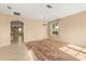 Open floor plan featuring hardwood floors, a chandelier, and seamless transition into adjacent areas at 9469 Edenshire Cir, Orlando, FL 32836