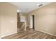 Upstairs landing with wood flooring and access to bedrooms and storage at 9469 Edenshire Cir, Orlando, FL 32836