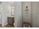 Bathroom featuring a granite countertop, white toilet, and tiled stand-up shower with bench at 951 Cutke Rd, St Cloud, FL 34771