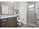 Bathroom featuring a granite countertop, white toilet, and tiled stand-up shower at 951 Cutke Rd, St Cloud, FL 34771