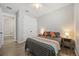 Comfortable bedroom featuring a ceiling fan, closet, and hardwood floors at 951 Cutke Rd, St Cloud, FL 34771