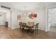 Formal dining room featuring a wooden table with seating for six and stylish decor at 951 Cutke Rd, St Cloud, FL 34771