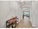 Welcoming hallway showcases tile flooring and an arched entryway to a living space at 951 Cutke Rd, St Cloud, FL 34771