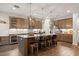 Gourmet kitchen island with pendant lighting, seating, and stainless steel appliances at 951 Cutke Rd, St Cloud, FL 34771