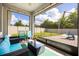 Screened patio featuring comfortable furniture, string lights and tile flooring at 951 Cutke Rd, St Cloud, FL 34771