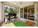 Screened patio featuring a BBQ grill, ceiling fan and tile flooring at 951 Cutke Rd, St Cloud, FL 34771