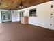 Covered patio with outdoor kitchen features and ceiling fans perfect for enjoying the outdoors at 9538 Lavill Ct, Windermere, FL 34786