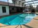 Inviting screened-in pool with a spacious deck, perfect for outdoor entertaining and relaxation at 9538 Lavill Ct, Windermere, FL 34786