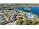 Beautiful aerial showcasing the community clubhouse, pool, tennis courts, and lakeside living at 1210 Pallister Ln, Lake Mary, FL 32746