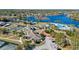 Breathtaking aerial view of community amenities, including pool, tennis courts, and lake at 1210 Pallister Ln, Lake Mary, FL 32746