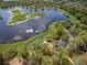 Expansive lakefront property with private dock, lush greenery, and serene views at 1210 Pallister Ln, Lake Mary, FL 32746