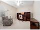Bedroom features a cozy patterned chair, desk, and bookshelves, perfect for relaxation and study at 1210 Pallister Ln, Lake Mary, FL 32746