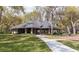 Welcoming community building with covered porch, outdoor seating, and well-maintained lawn at 1210 Pallister Ln, Lake Mary, FL 32746