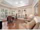 Cozy dining room with hardwood floors, ample natural light, and stylish decor ideal for intimate gatherings at 1210 Pallister Ln, Lake Mary, FL 32746