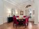 Elegant dining room featuring hardwood floors, modern lighting, and stylish decor perfect for entertaining guests at 1210 Pallister Ln, Lake Mary, FL 32746