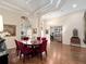 Elegant dining room features tray ceilings, hardwood floors, stylish decor and opens to other living areas at 1210 Pallister Ln, Lake Mary, FL 32746