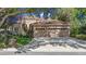 Beautiful one-story stucco home featuring a three-car garage and meticulously landscaped front yard at 1210 Pallister Ln, Lake Mary, FL 32746