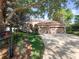 Charming home with a well-manicured lawn, mature landscaping, and a spacious three-car garage at 1210 Pallister Ln, Lake Mary, FL 32746