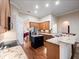 Spacious kitchen features a central island, stainless steel refrigerator, and ample wood cabinetry at 1210 Pallister Ln, Lake Mary, FL 32746