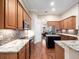 Well-appointed kitchen featuring granite countertops and stainless steel appliances at 1210 Pallister Ln, Lake Mary, FL 32746