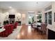 Inviting living room with fireplace, modern decor, and hardwood floors for comfortable living and elegant dining at 1210 Pallister Ln, Lake Mary, FL 32746