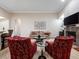 Inviting living room featuring a comfortable seating arrangement, fireplace, and stylish decor for relaxing and entertaining at 1210 Pallister Ln, Lake Mary, FL 32746