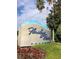 Welcome to Floridays Resort Orlando, a beautiful entrance with flowers and mature landscaping at 12539 Floridays Resort Dr 411 # 411D, Orlando, FL 32821