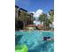 Enjoy the refreshing community pool surrounded by lush landscaping and resort-style amenities at 12539 Floridays Resort Dr 411 # 411D, Orlando, FL 32821