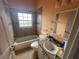 Standard bathroom featuring tiled shower-tub combo and single sink vanity at 2600 Cedar Bluff Ln, Ocoee, FL 34761