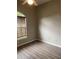 This bedroom features hardwood floors, a large window, and a ceiling fan at 2600 Cedar Bluff Ln, Ocoee, FL 34761