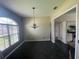 Bright dining room featuring modern lighting fixtures and views into the kitchen at 2600 Cedar Bluff Ln, Ocoee, FL 34761