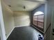 Cozy dining room with a chandelier and ample natural light from a large window at 2600 Cedar Bluff Ln, Ocoee, FL 34761
