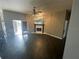 Inviting living room with a fireplace and sliding glass doors leading to the patio at 2600 Cedar Bluff Ln, Ocoee, FL 34761