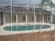 Inviting screened-in pool with an attached spa offering a tranquil backyard oasis at 2600 Cedar Bluff Ln, Ocoee, FL 34761